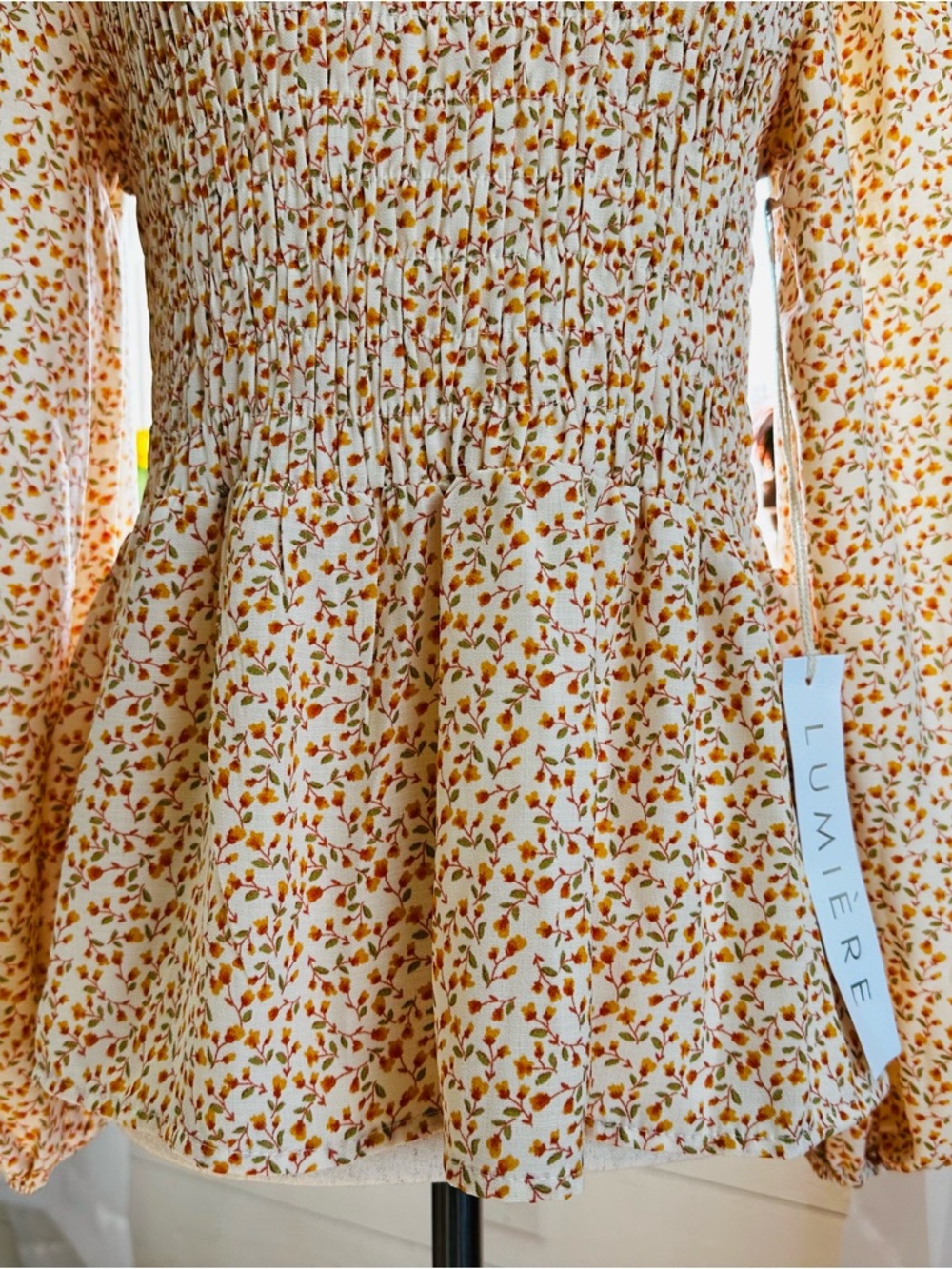 Lumiere long sleeve feminine Floral Print Smocked Peplum Top. 
Size: Small - Picture 3 of 11